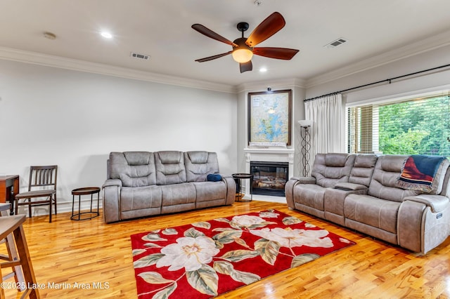 64 Stoneview Summit Ct Unit 5206, Dadeville, AL 36853 - living room with crown molding, a ceiling fan, wood finished floors, a glass covered fireplace, and recessed lighting