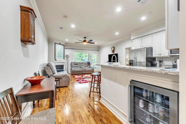 64 Stoneview Summit Ct Unit 5206, Dadeville, AL 36853 - kitchen featuring stainless steel fridge, wine cooler, ornamental molding, a peninsula, and ceiling fan