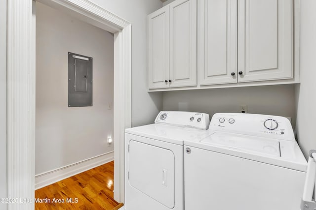 64 Stoneview Summit Ct Unit 5206, Dadeville, AL 36853 - washroom featuring electric panel, washer and dryer, cabinet space, and light wood-type flooring