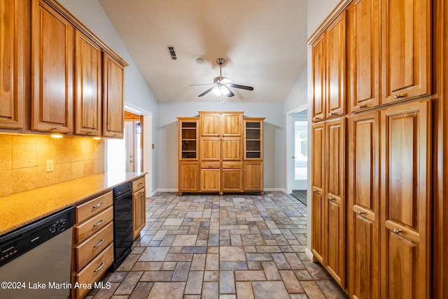 kitchen with dishwasher, ceiling fan, backsplash, built in desk, and vaulted ceiling