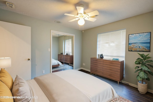 bedroom with ceiling fan and dark hardwood / wood-style floors