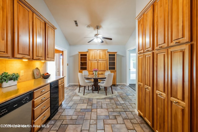 kitchen with built in desk, lofted ceiling, backsplash, stainless steel dishwasher, and ceiling fan