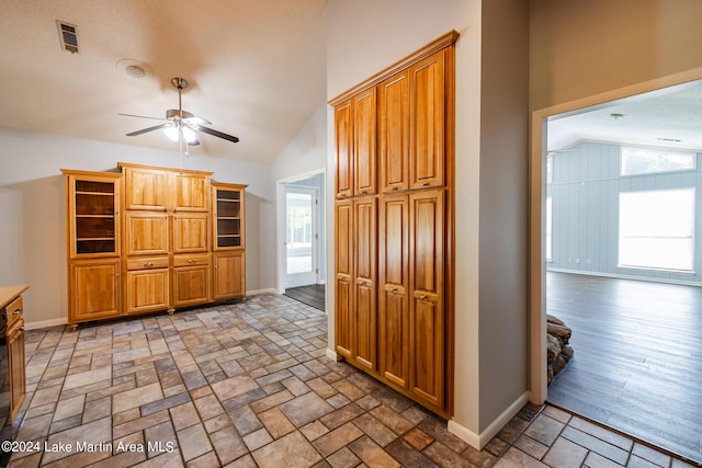 kitchen with vaulted ceiling and ceiling fan