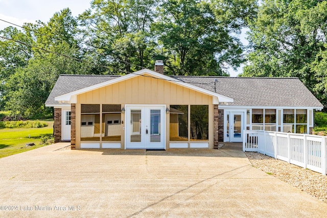 back of property featuring french doors