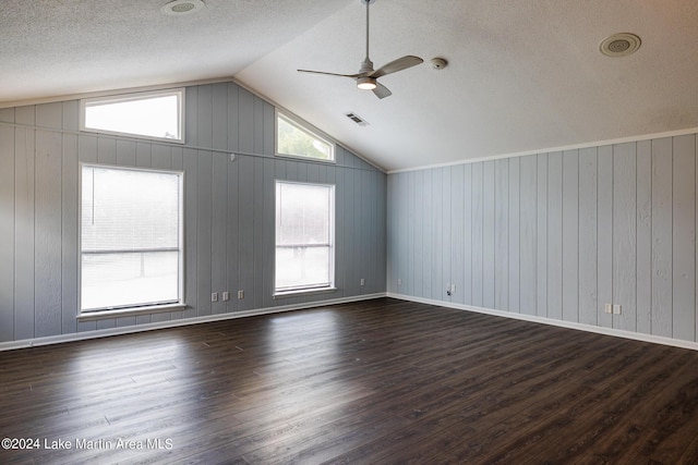 bonus room with dark wood-type flooring, ceiling fan, and vaulted ceiling