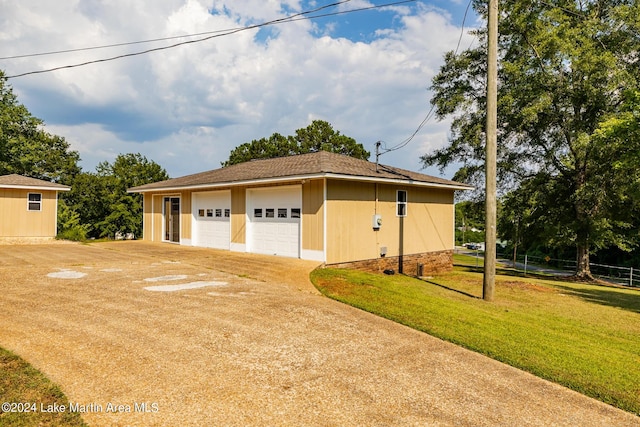 garage with a yard