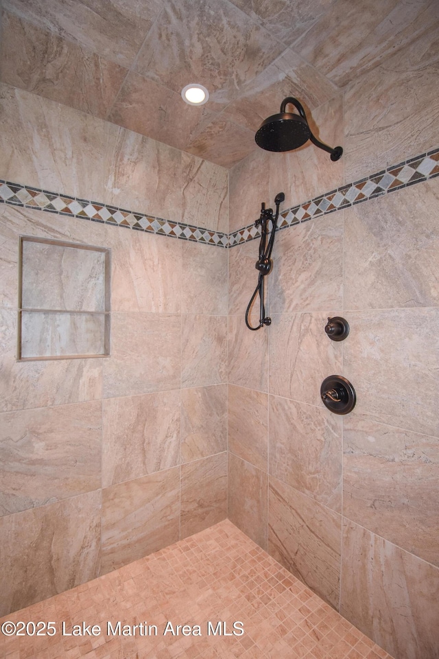 full bathroom with a tile shower