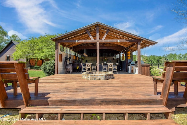 deck with fence and outdoor dry bar