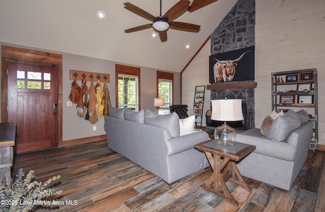 living room with a stone fireplace, recessed lighting, ceiling fan, and dark wood finished floors