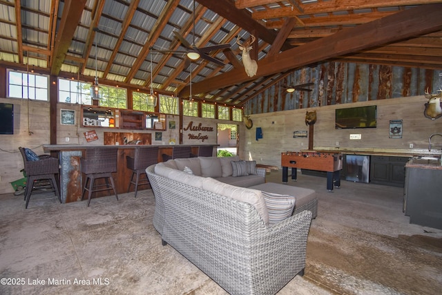 living room featuring high vaulted ceiling