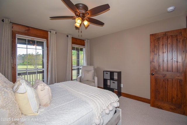 bedroom with carpet flooring, access to exterior, baseboards, and a ceiling fan