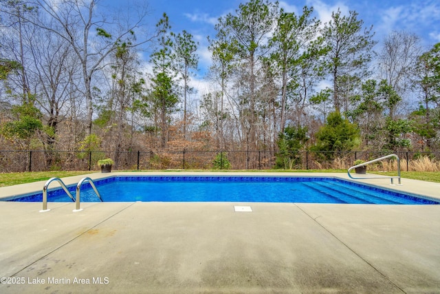 view of pool featuring fence, a fenced in pool, and a patio