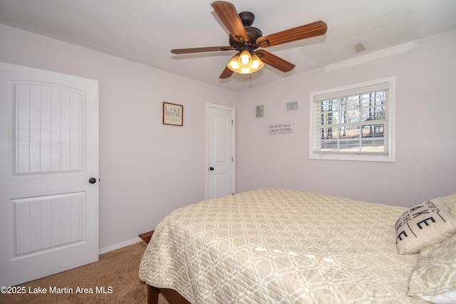 carpeted bedroom with ceiling fan