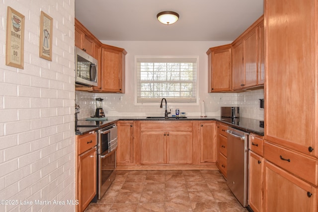 kitchen with sink, stainless steel appliances, and decorative backsplash