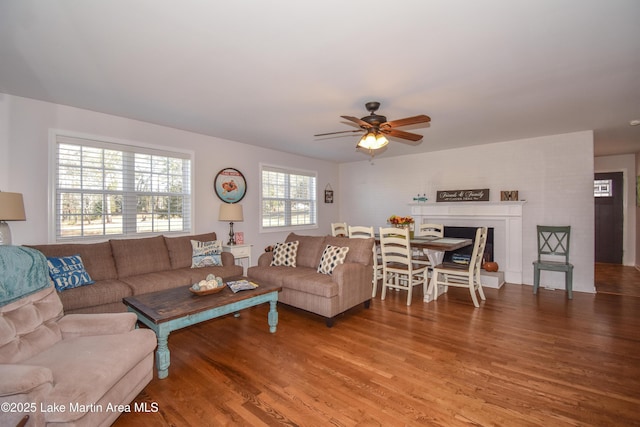 living room featuring hardwood / wood-style flooring and ceiling fan