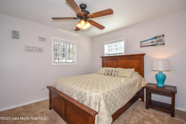 bedroom featuring ceiling fan and light colored carpet