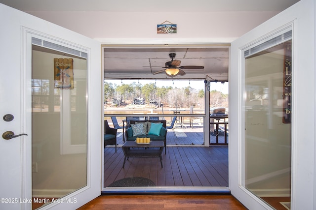 doorway with ceiling fan
