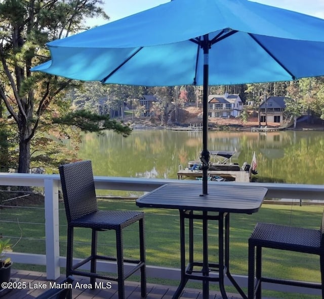 exterior space with a lawn and a water view