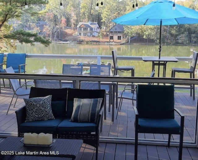 wooden deck with a water view