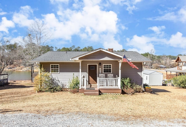32 Dennis Creek Cir, Jacksons Gap, AL 36861 - view of front facade with a porch, a chimney, and roof with shingles