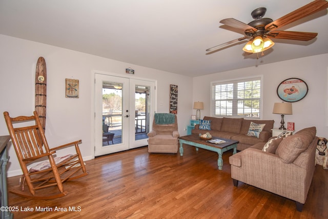 living room featuring ceiling fan, french doors, hardwood / wood-style floors, and a wealth of natural light