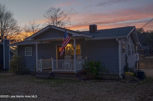 view of front of property with central AC and a wooden deck