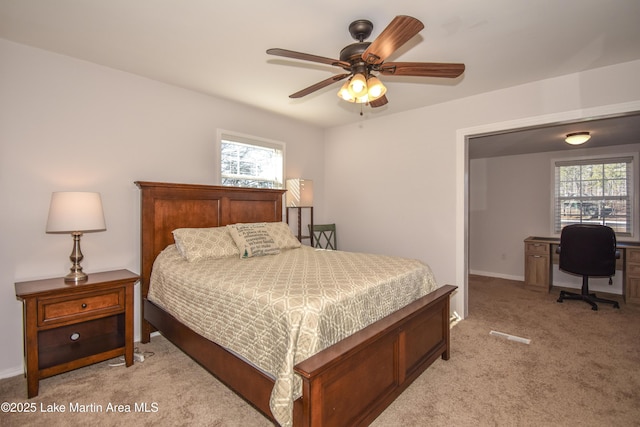 32 Dennis Creek Cir, Jacksons Gap, AL 36861 - bedroom featuring light colored carpet, multiple windows, a desk, and a ceiling fan