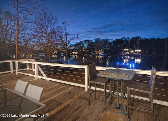 deck at dusk with a water view
