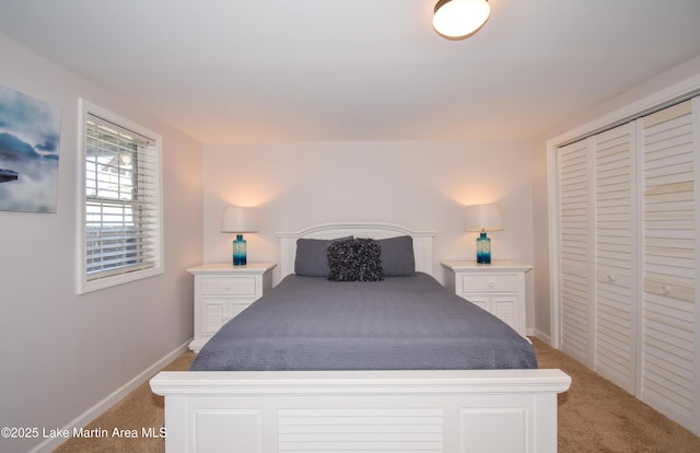 carpeted bedroom with a closet