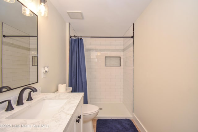 32 Dennis Creek Cir, Jacksons Gap, AL 36861 - bathroom featuring vanity, a tile shower, and tile patterned floors