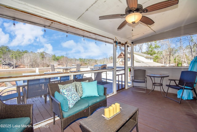 deck with ceiling fan and an outdoor hangout area