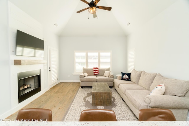 153 Whisper Trce, Tallassee, AL 36078 - living area with high vaulted ceiling, a ceiling fan, light wood-type flooring, and a fireplace