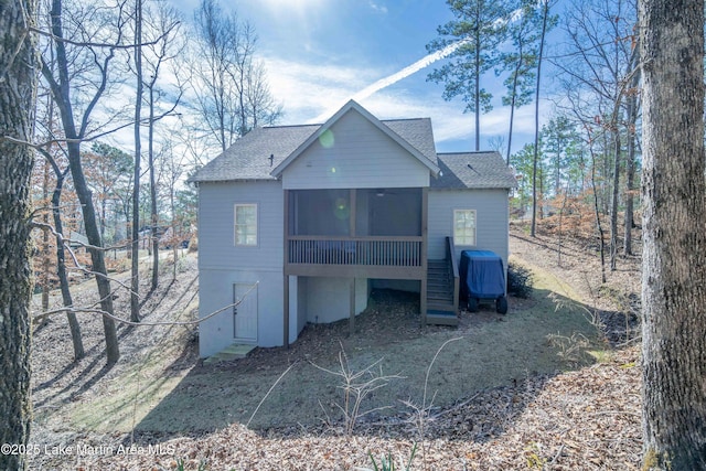 153 Whisper Trce, Tallassee, AL 36078 - rear view of house featuring a sunroom, a shingled roof, and stairs