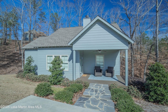153 Whisper Trce, Tallassee, AL 36078 - view of front of house with a ceiling fan, covered porch, roof with shingles, and a chimney