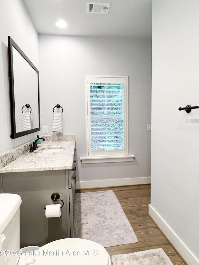 153 Whisper Trce, Tallassee, AL 36078 - half bathroom featuring wood finished floors, vanity, and recessed lighting