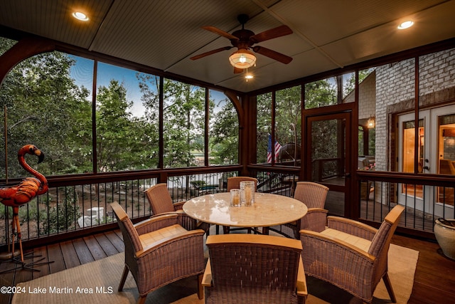 sunroom / solarium featuring ceiling fan