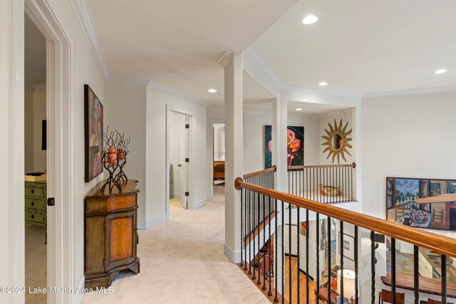 corridor with light carpet and ornamental molding