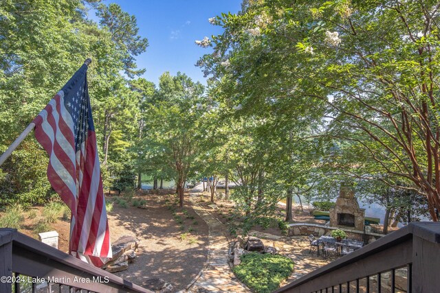 exterior space featuring an outdoor stone fireplace