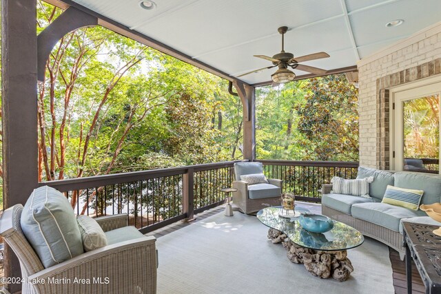 exterior space featuring an outdoor living space and ceiling fan