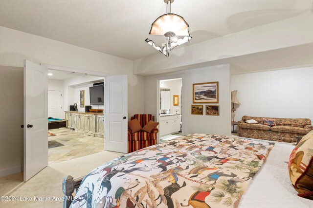 carpeted bedroom featuring connected bathroom