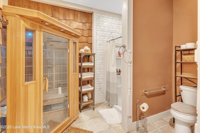 bathroom with tile patterned flooring and toilet