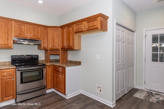 kitchen featuring a textured ceiling, dark hardwood / wood-style floors, stainless steel range with electric stovetop, and stone countertops