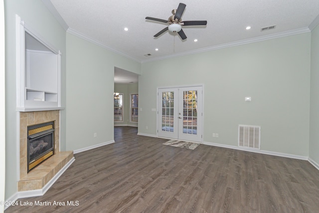 unfurnished living room featuring french doors, dark hardwood / wood-style flooring, a textured ceiling, and ceiling fan