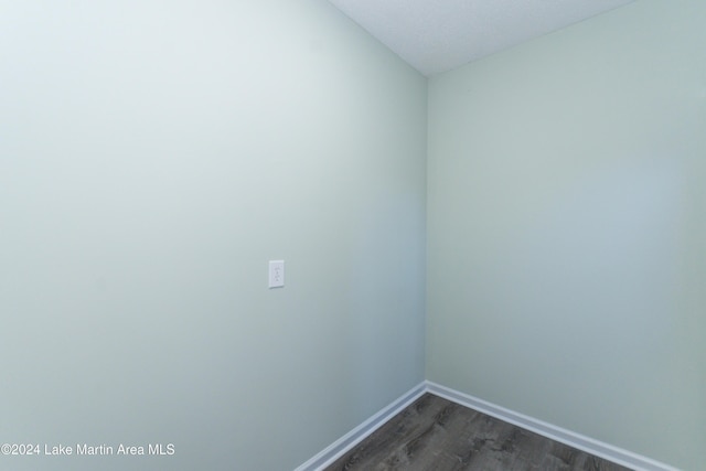 empty room featuring dark hardwood / wood-style flooring