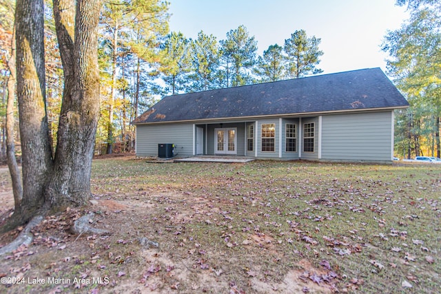 back of house featuring french doors and cooling unit