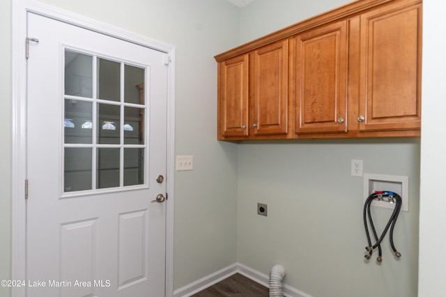 laundry room featuring hookup for an electric dryer, cabinets, hardwood / wood-style floors, and hookup for a washing machine