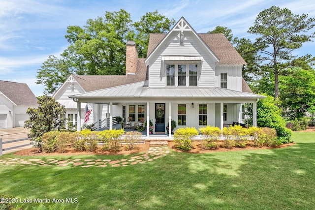 view of front of home featuring a front lawn and covered porch