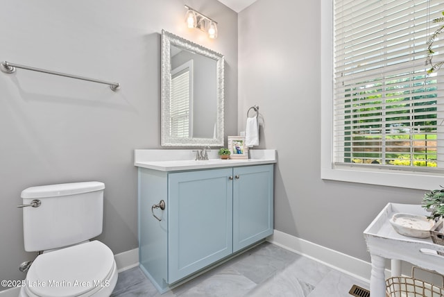 bathroom with vanity and toilet