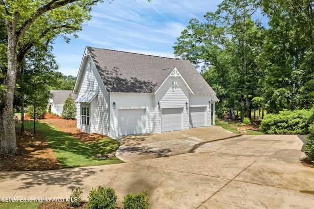 view of property exterior with a yard and a garage