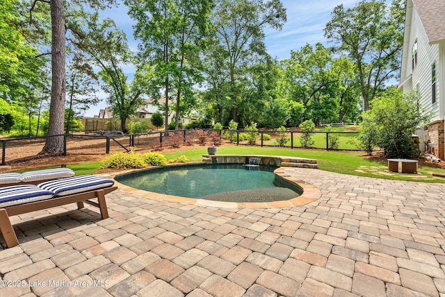 view of swimming pool featuring a patio area